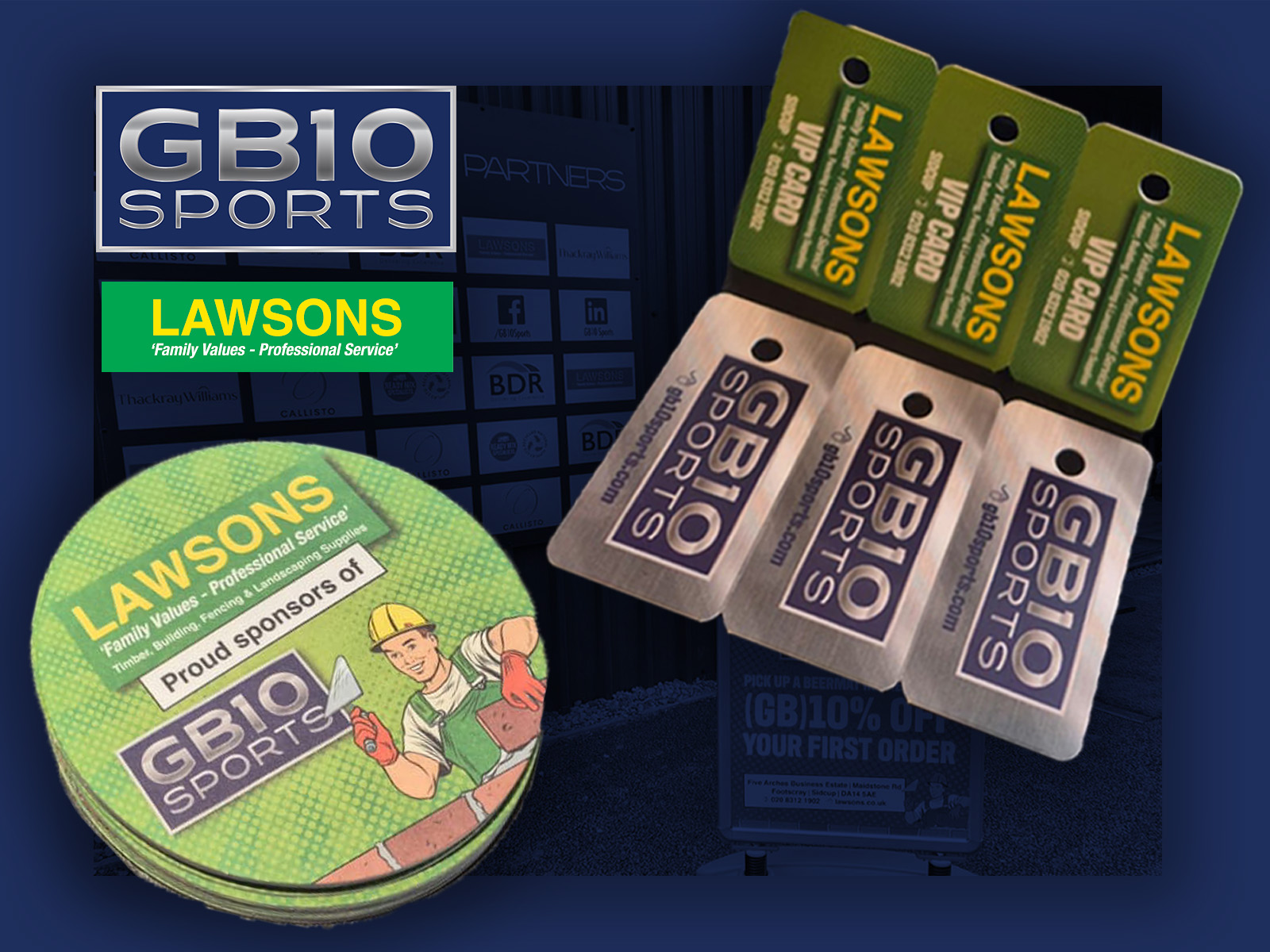 A promotional display of GB10 Sports and Lawsons branded merchandise, including key tags, VIP cards, and coasters. The items promote a new partnership offering discounts to GB10 Sports members, with Lawsons featured as a proud sponsor.