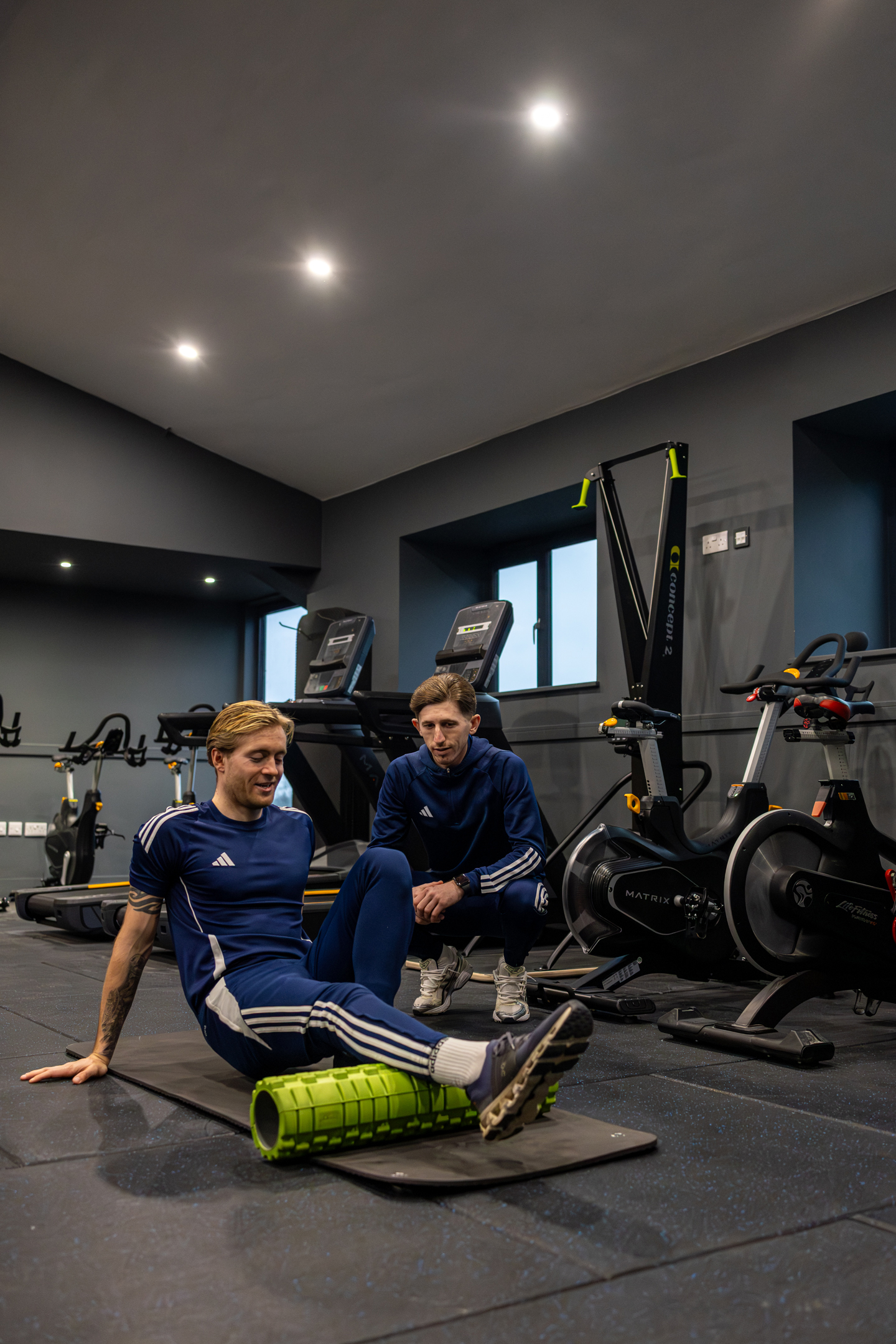 View of GB10 Eltham Hall with double doors opening onto outdoor terrace seating.