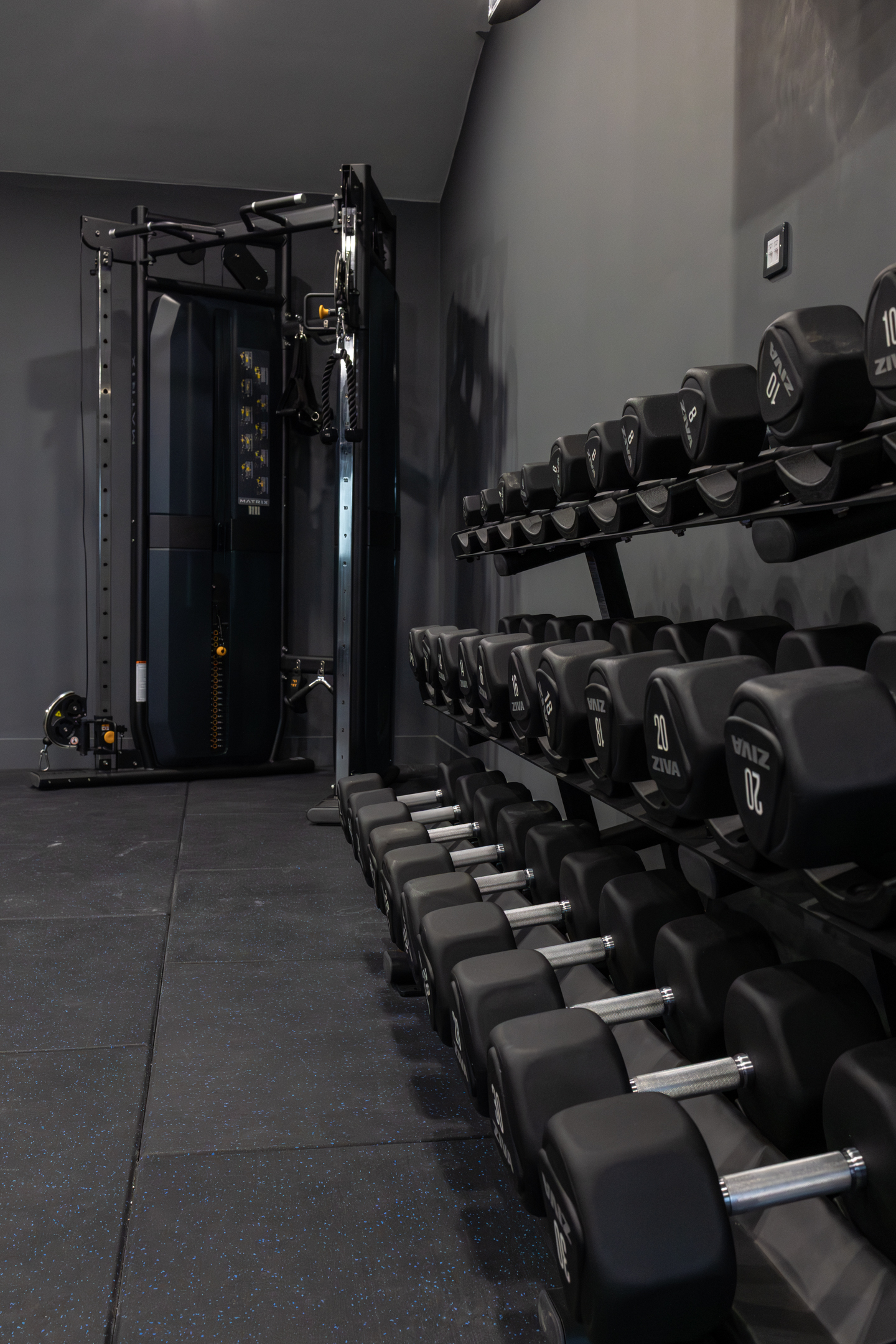 Bar seating area with stools and pendant lights inside GB10 Eltham event space.