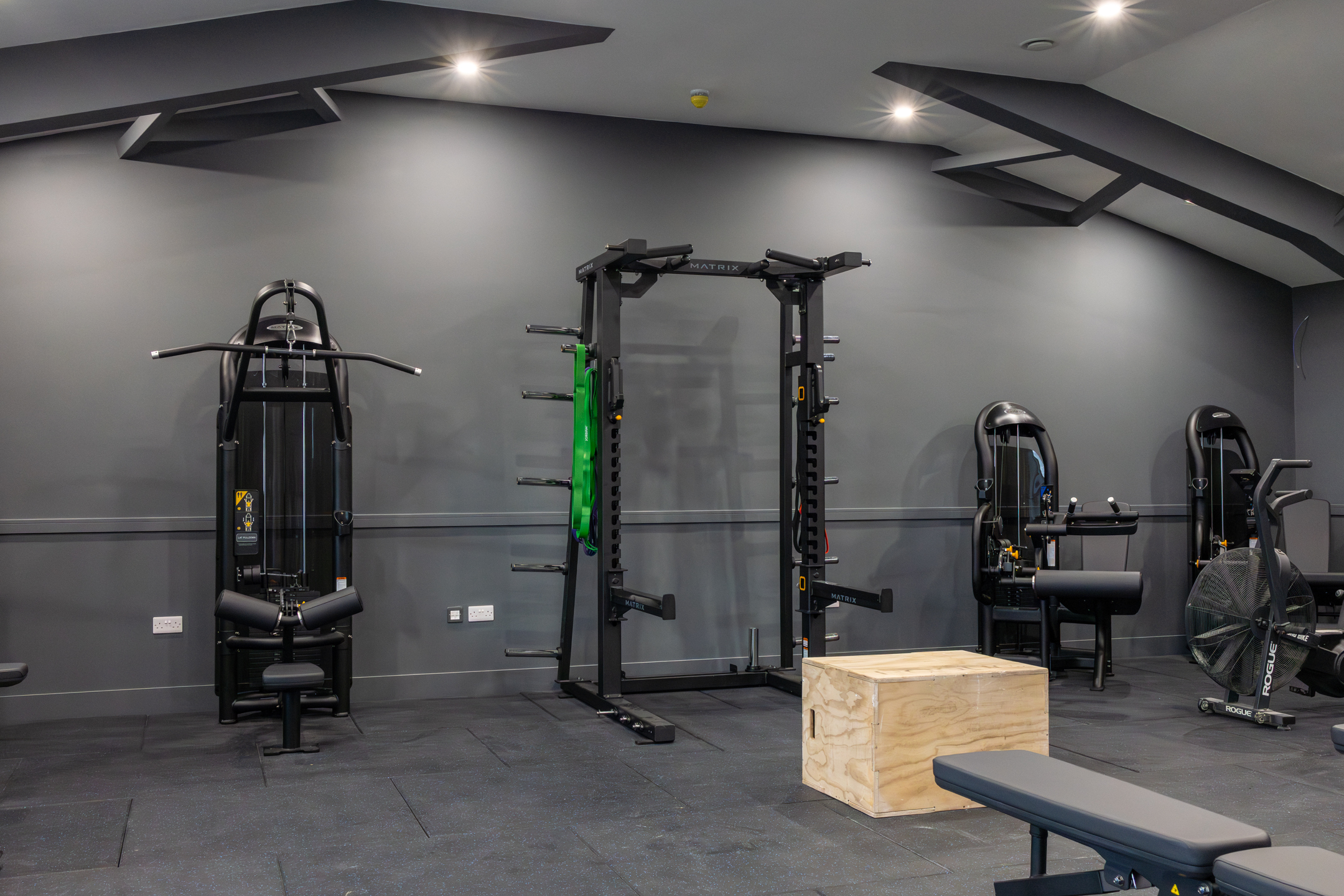 View of GB10 Eltham Hall with double doors opening onto outdoor terrace seating.