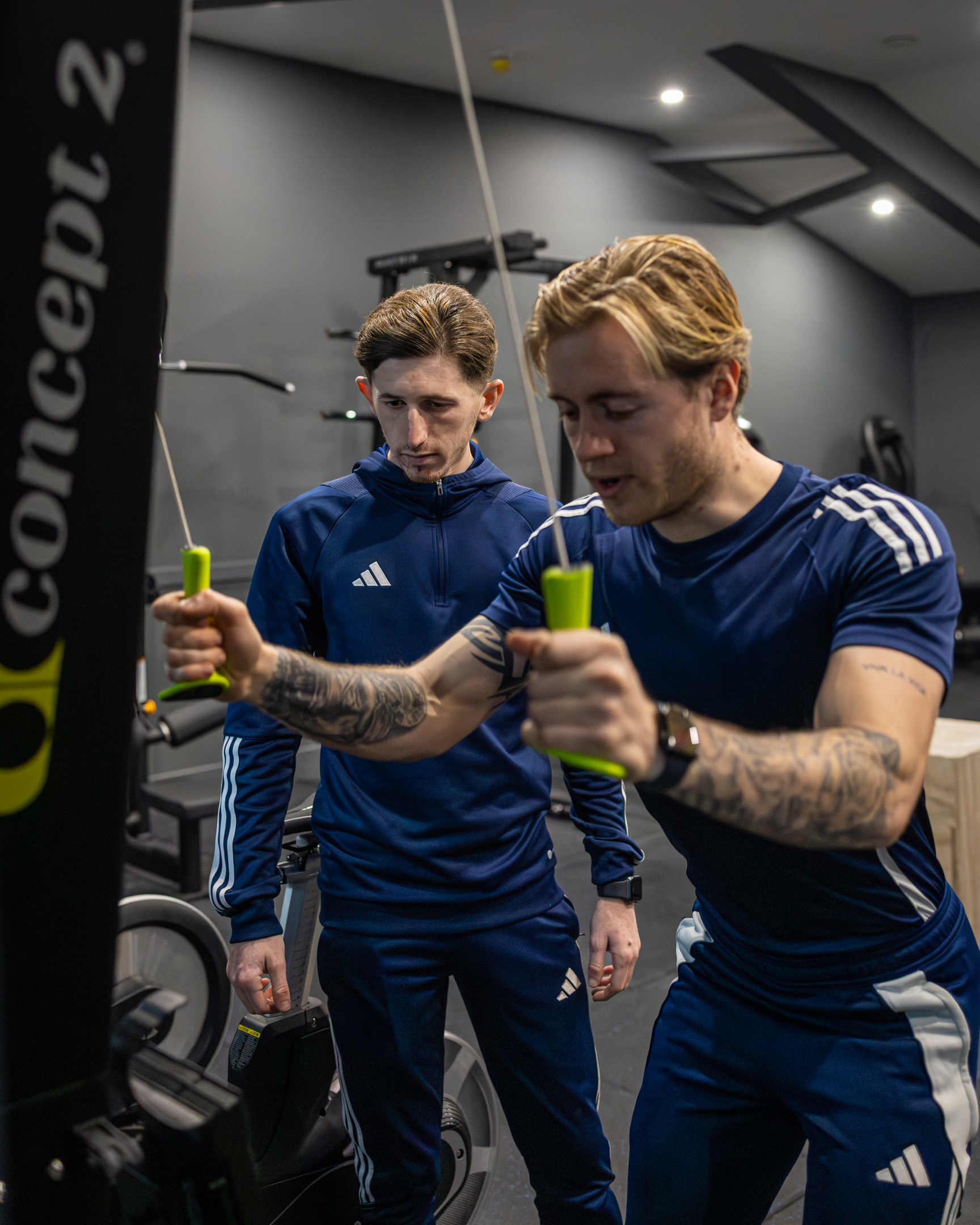 Bar seating area with stools and pendant lights inside GB10 Eltham event space.