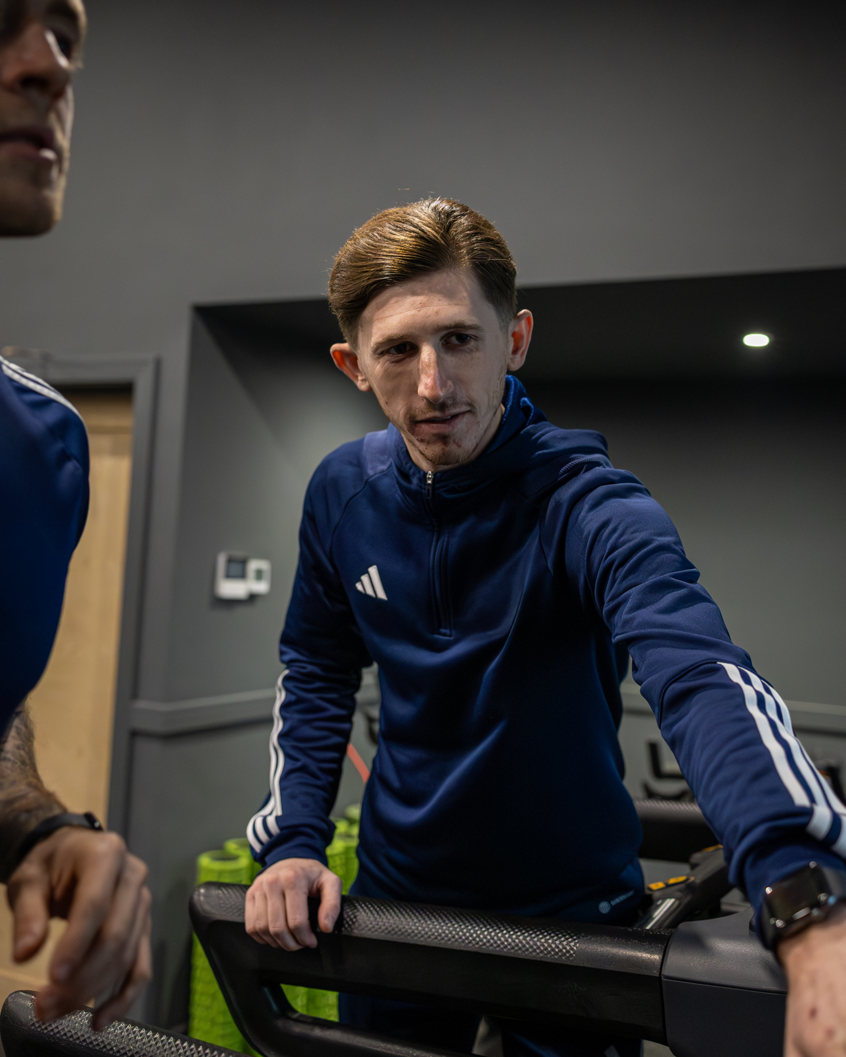 Bar seating area with stools and pendant lights inside GB10 Eltham event space.