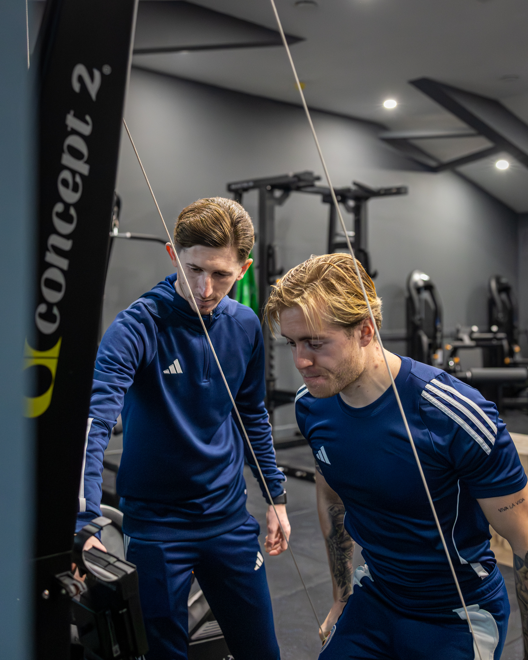 View of GB10 Eltham Hall with double doors opening onto outdoor terrace seating.