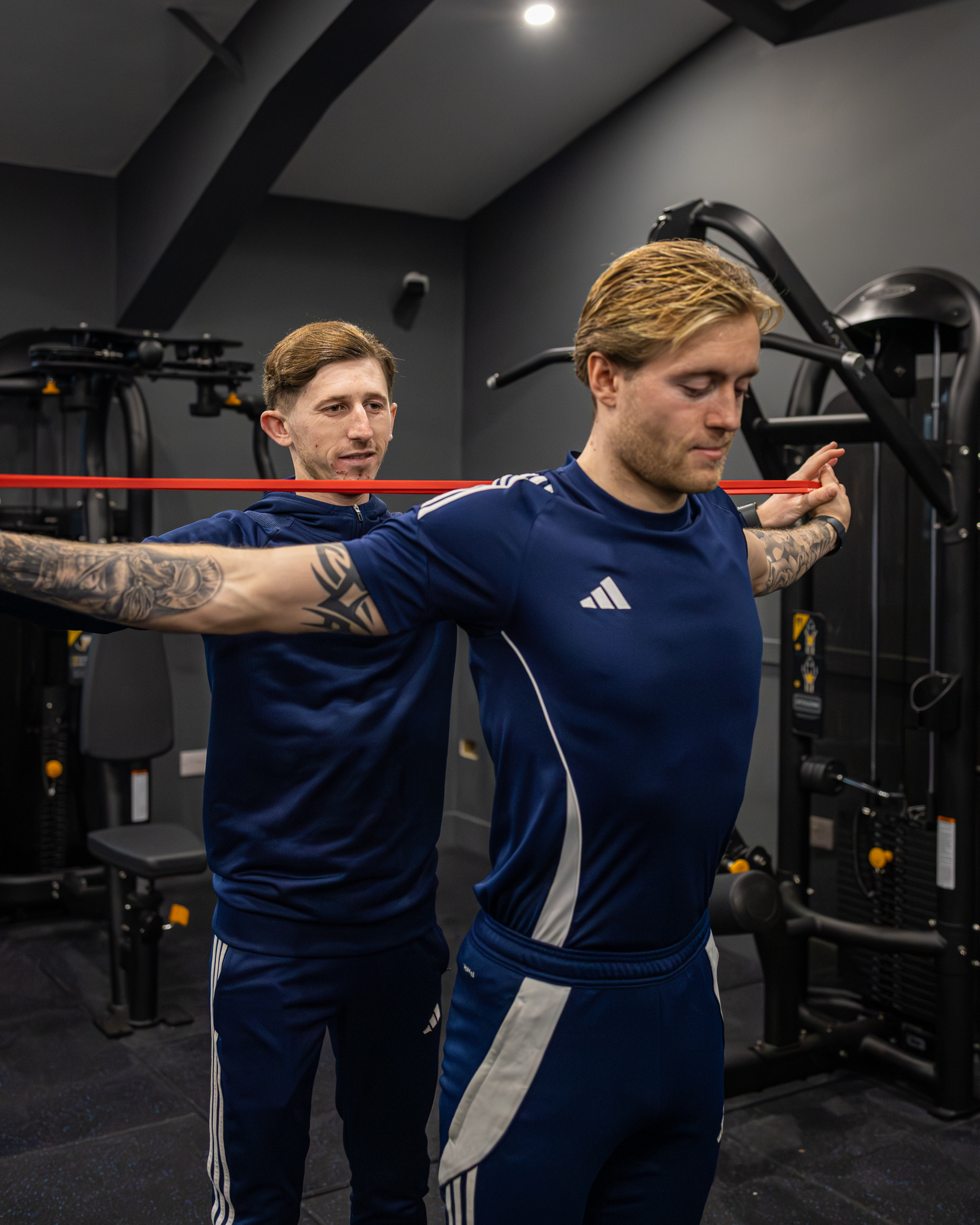 Bar seating area with stools and pendant lights inside GB10 Eltham event space.